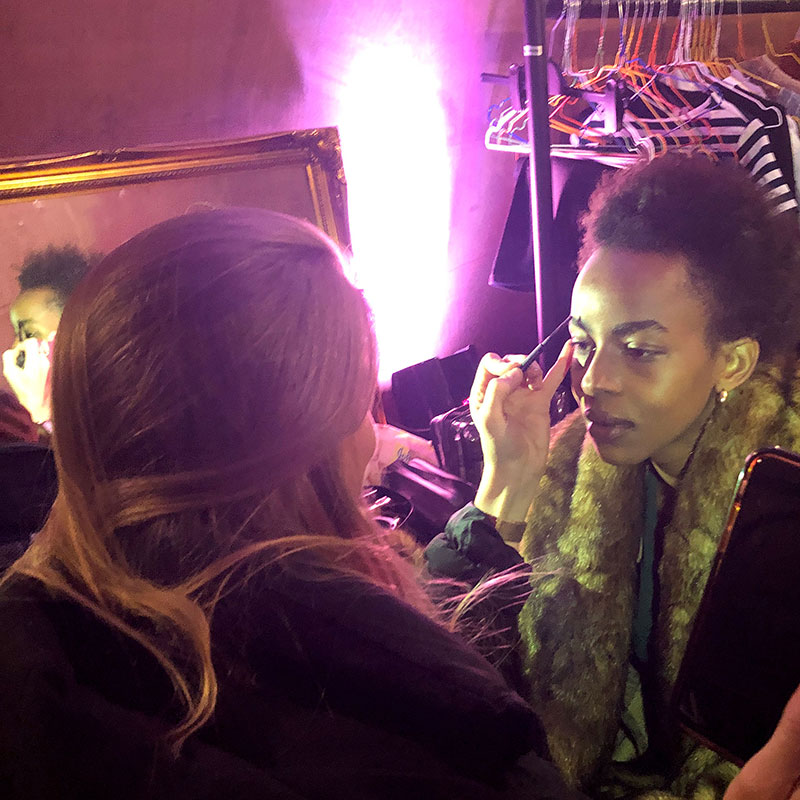 Make-up being applied by stylist to female model at Catch London Boots 2019 photo shoot